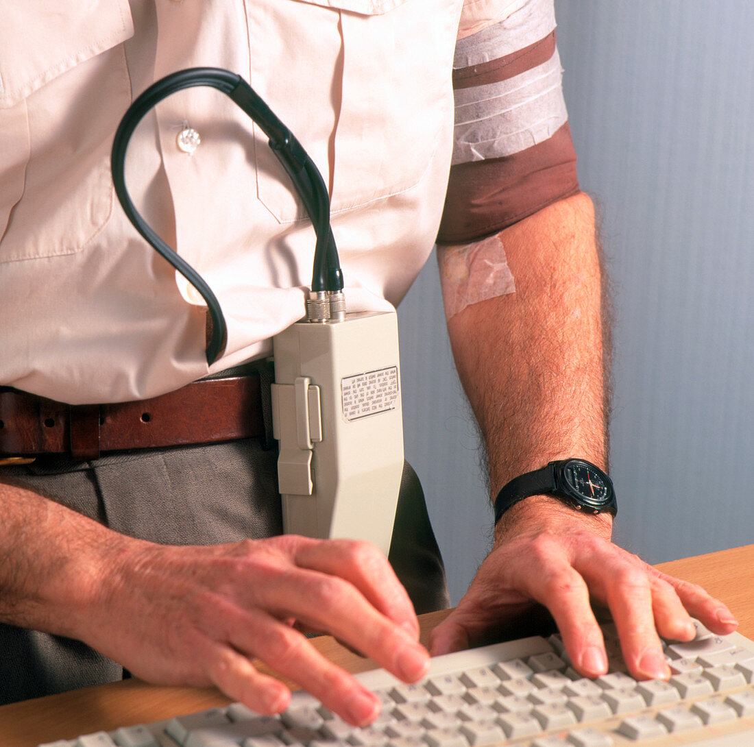 Man wearing ambulatory blood pressure monitor