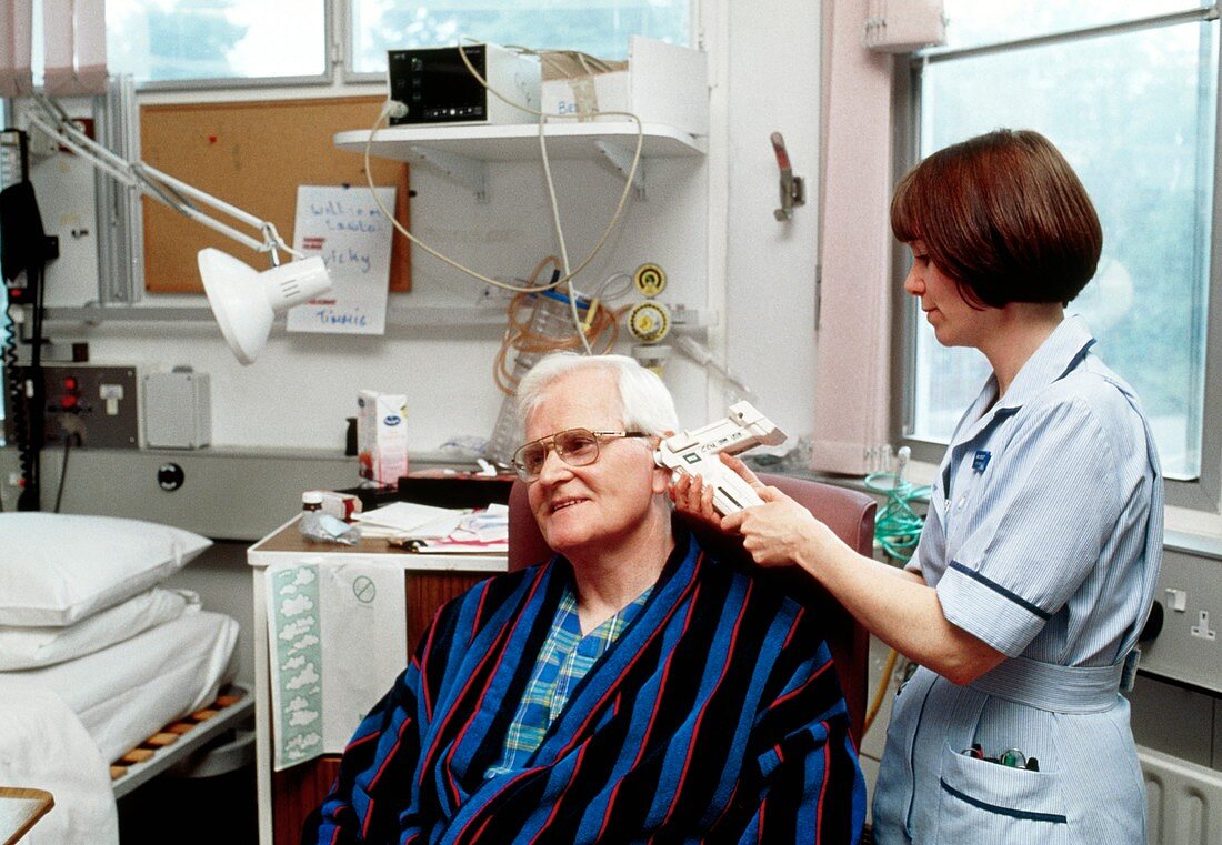 Nurse measuring patient's temperature