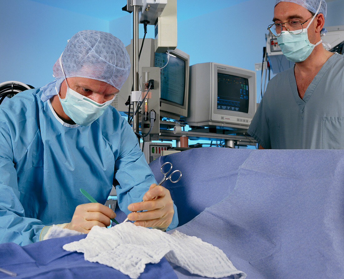 Surgeon and anaesthetist in operating theatre