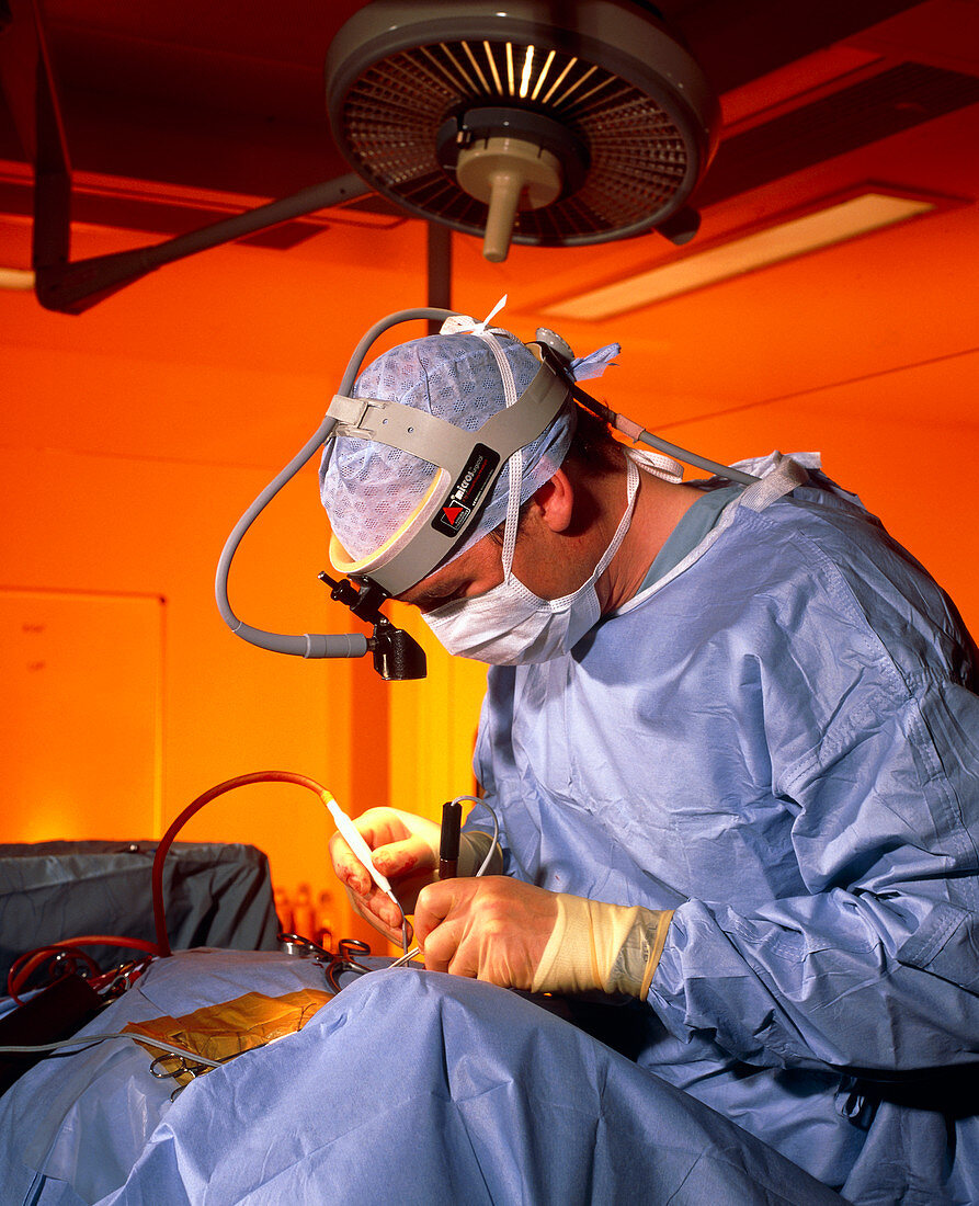 Surgeon performs surgery for neck fusion
