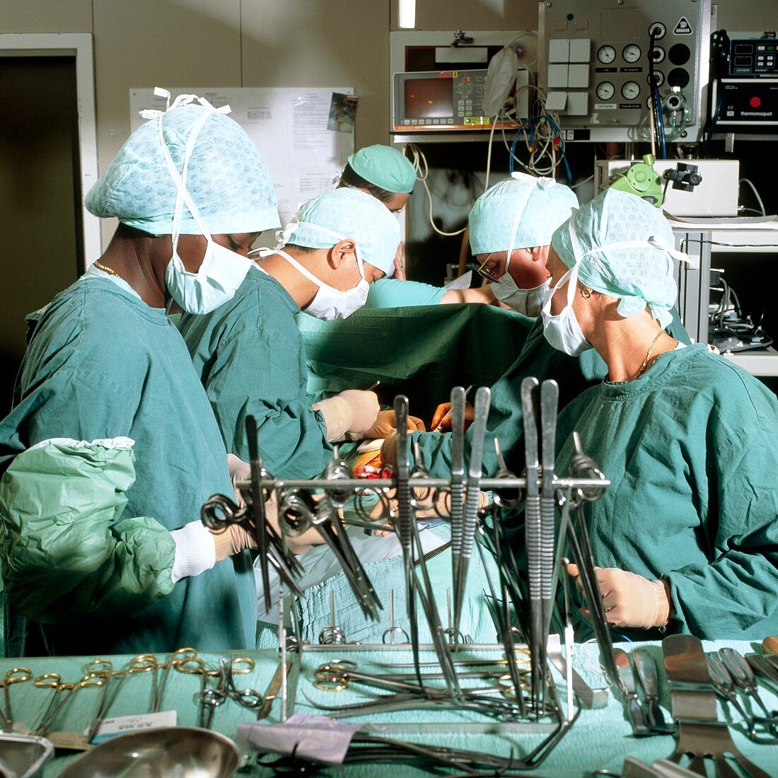 View of a team of surgeons operating on the lung