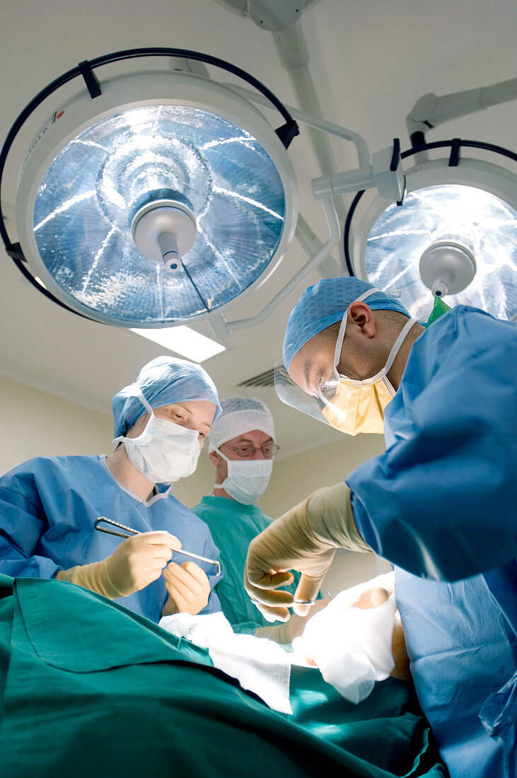 Surgeons operating