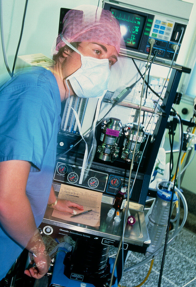 Anaesthetist monitoring anaesthetic equipment