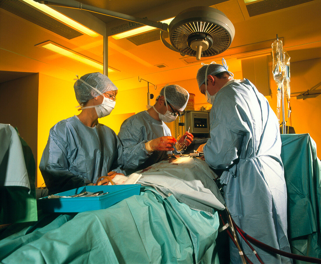 Surgeons perform triple bypass surgery on heart