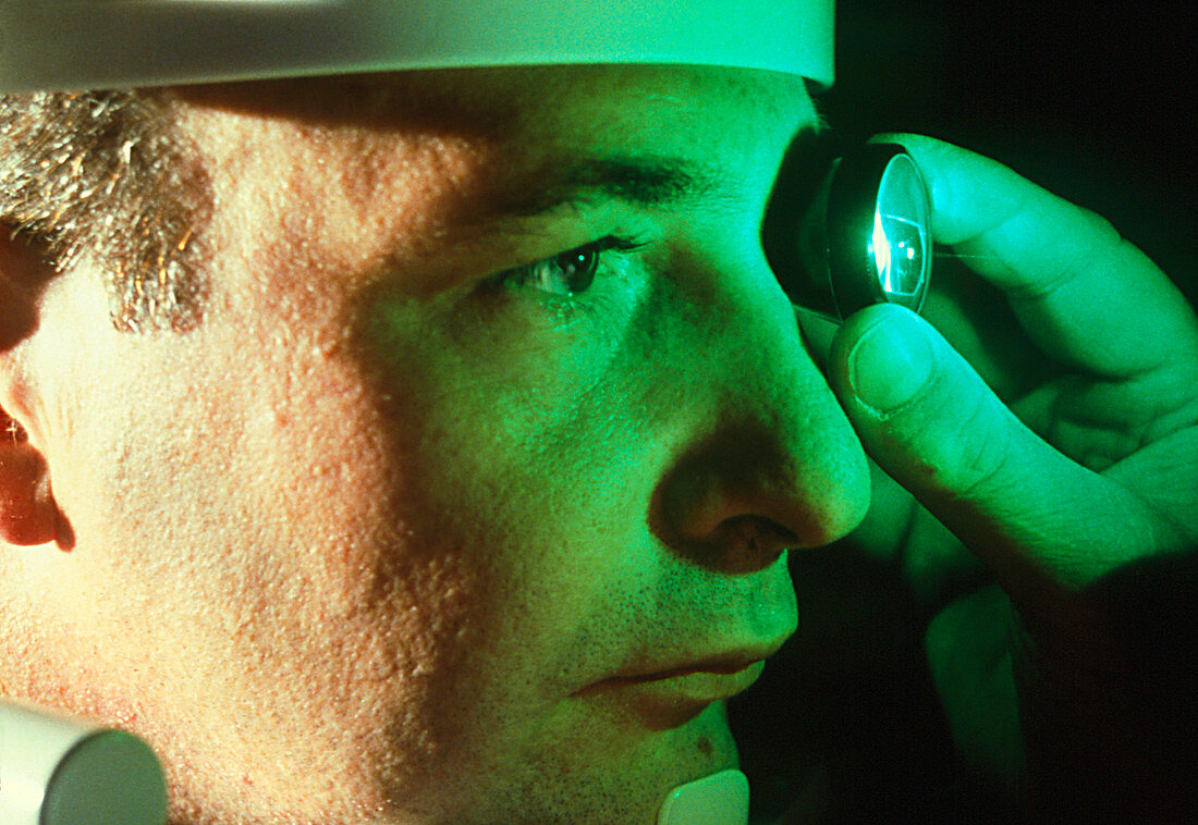 Examination of a man's eye before surgery