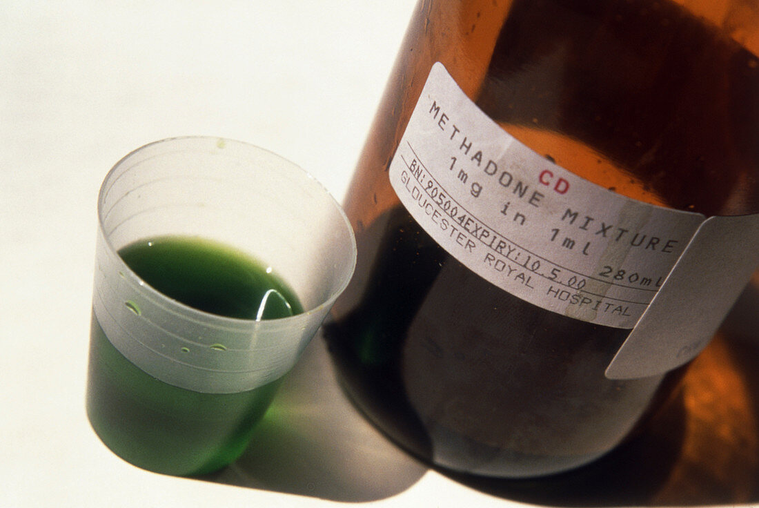 Bottle and beaker containing the drug methadone