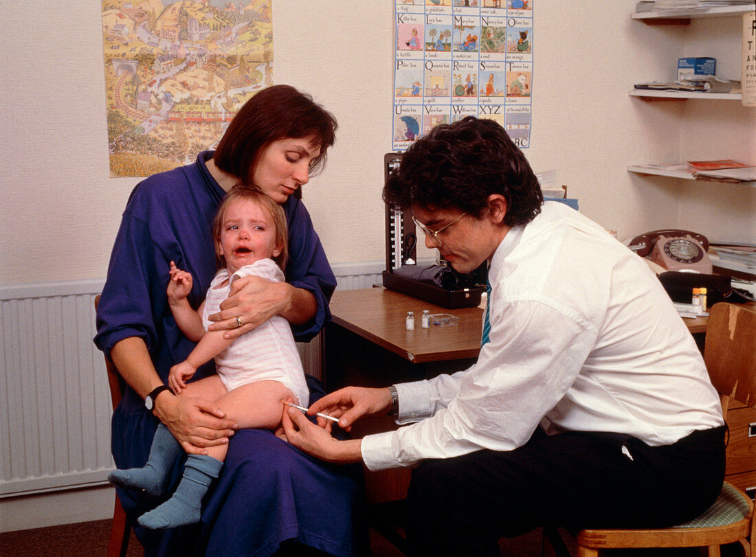 Infant receives MMR vaccination