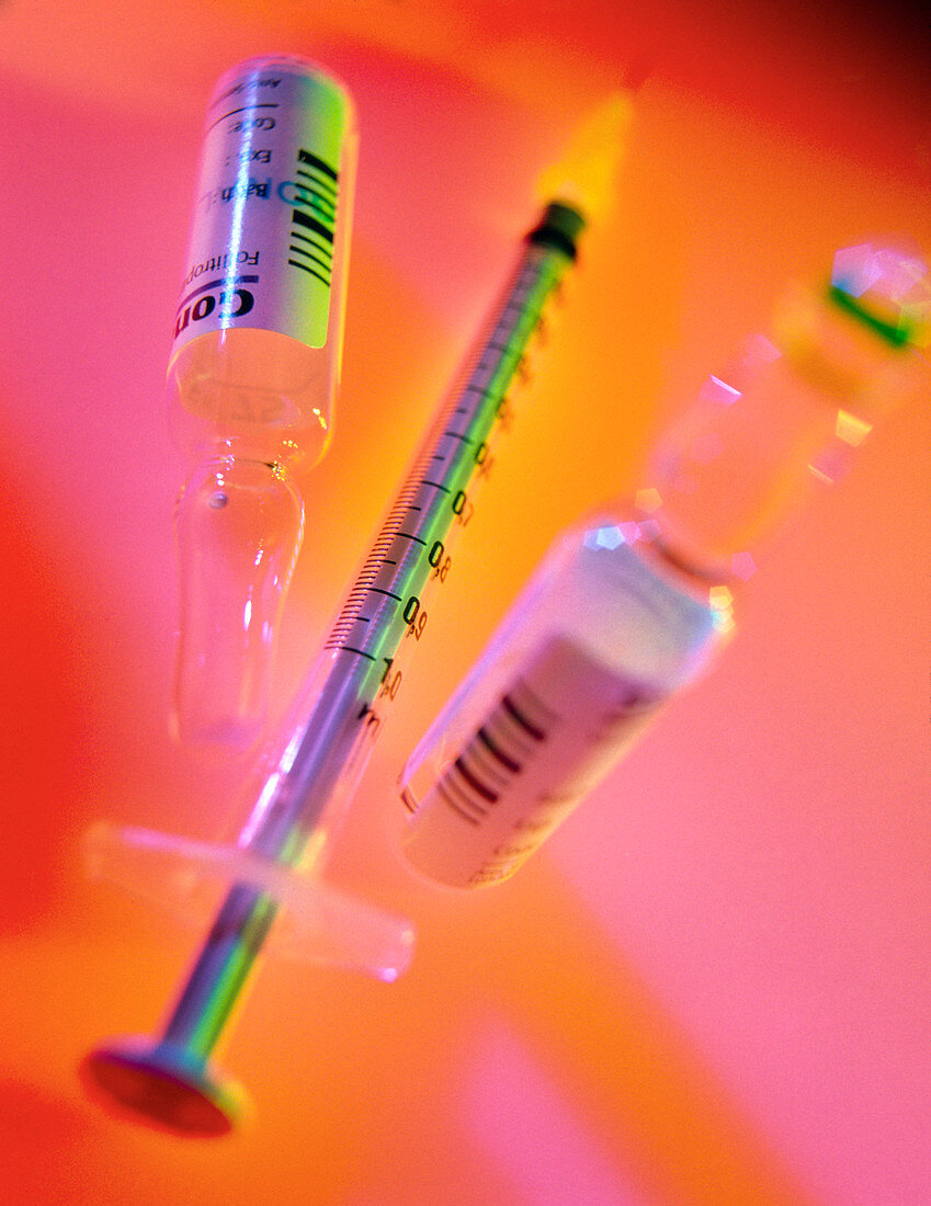 Syringe with two vials containing infertility drug