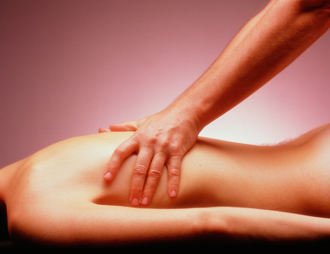 Man massaging woman's back