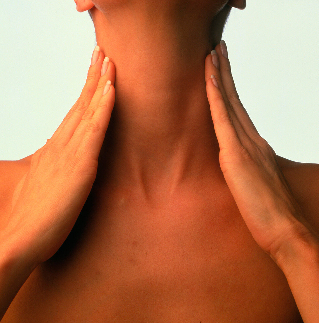 Neck massage: hands of woman during self-massage