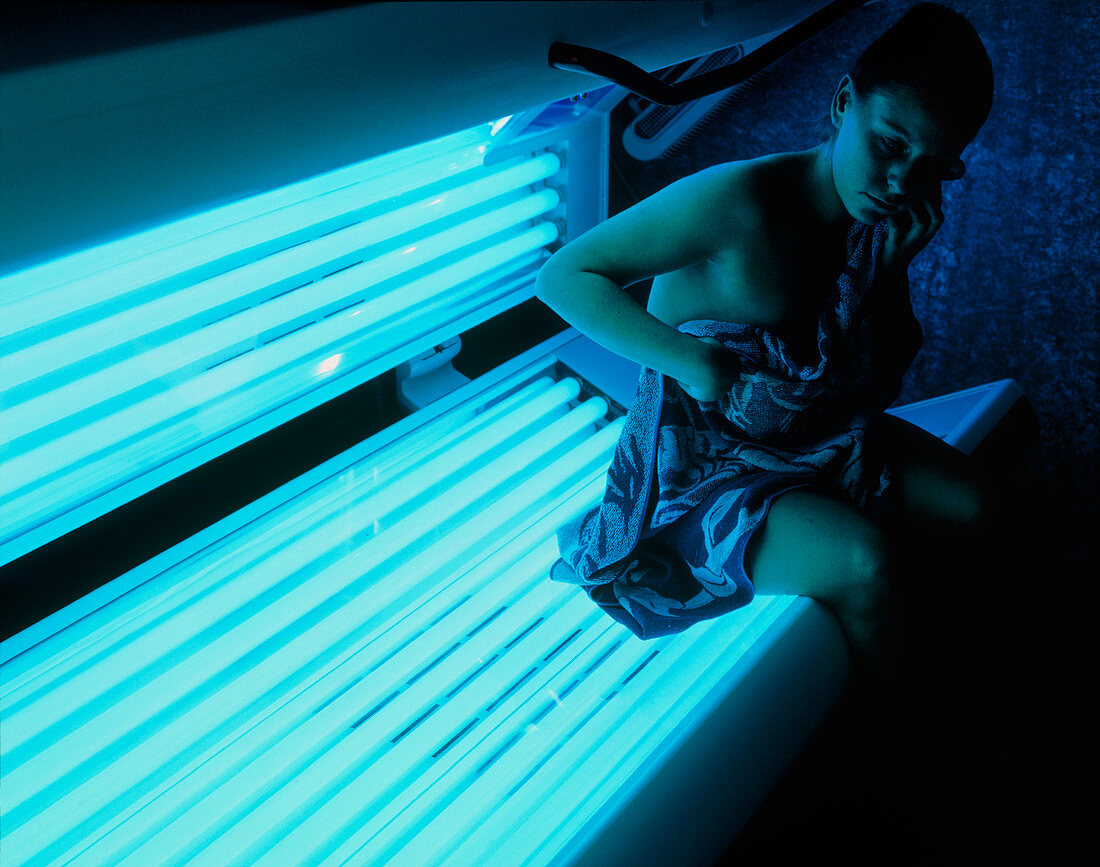 Woman getting off a sunbed