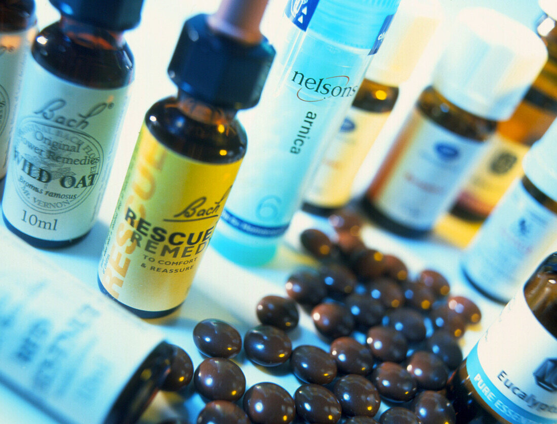 Bottles and pills of alternative remedies