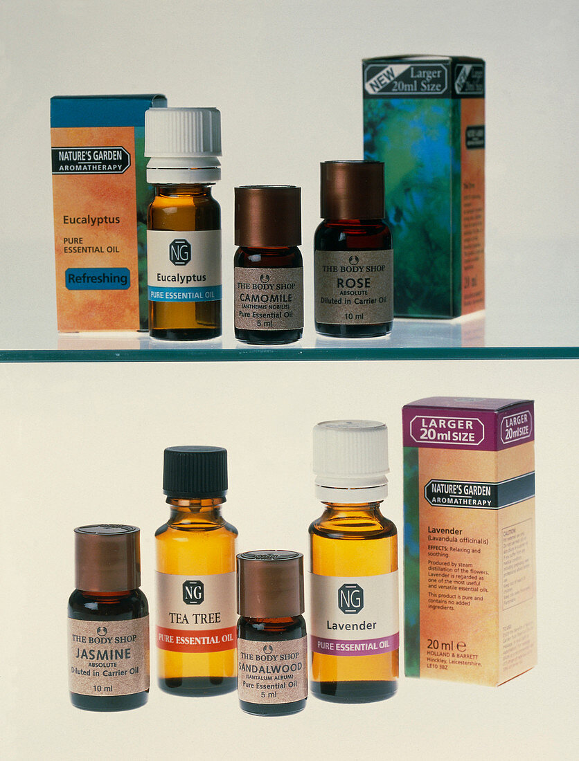 Bottles containing aromatherapy oils in a cabinet
