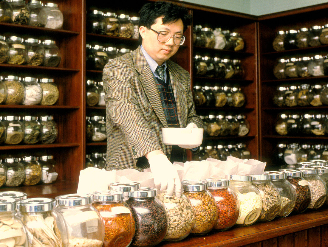 Herbalist in a Chinese herbal medicine pharmacy