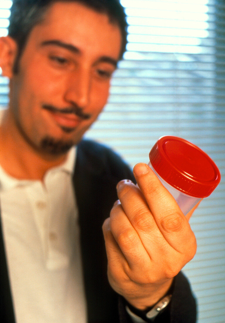 Man with semen sample for artificial insemination