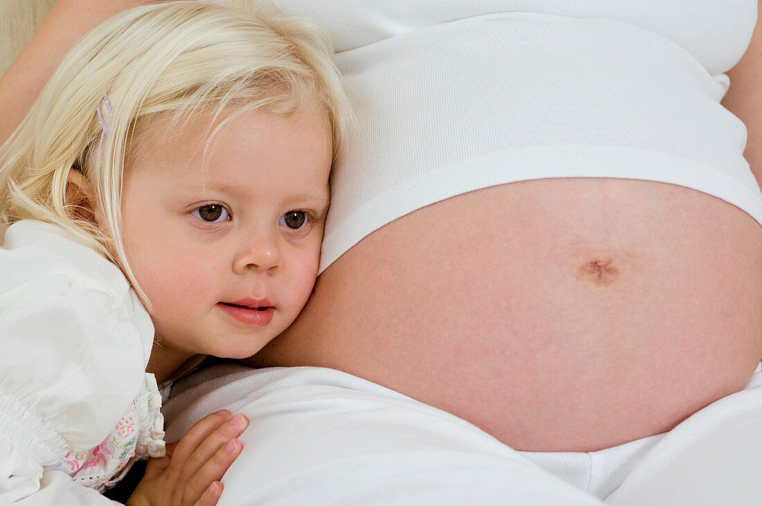 Pregnant woman and daughter