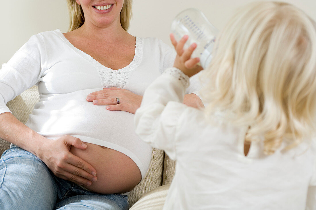 Pregnant woman and daughter