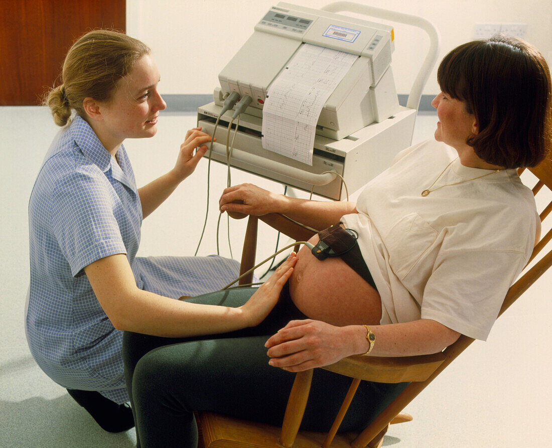 Midwife checks foetal heartbeat
