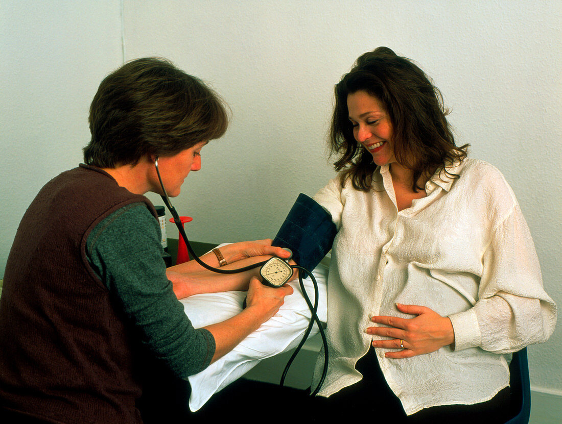 Pregnant woman's blood pressure taken