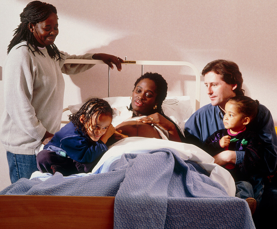 Pregnant woman and her family on an antenatal ward