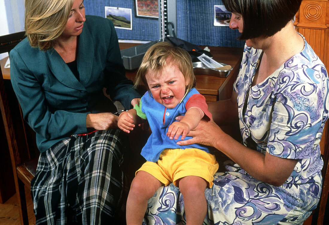 15-month-old boy having tantrum at doctor's