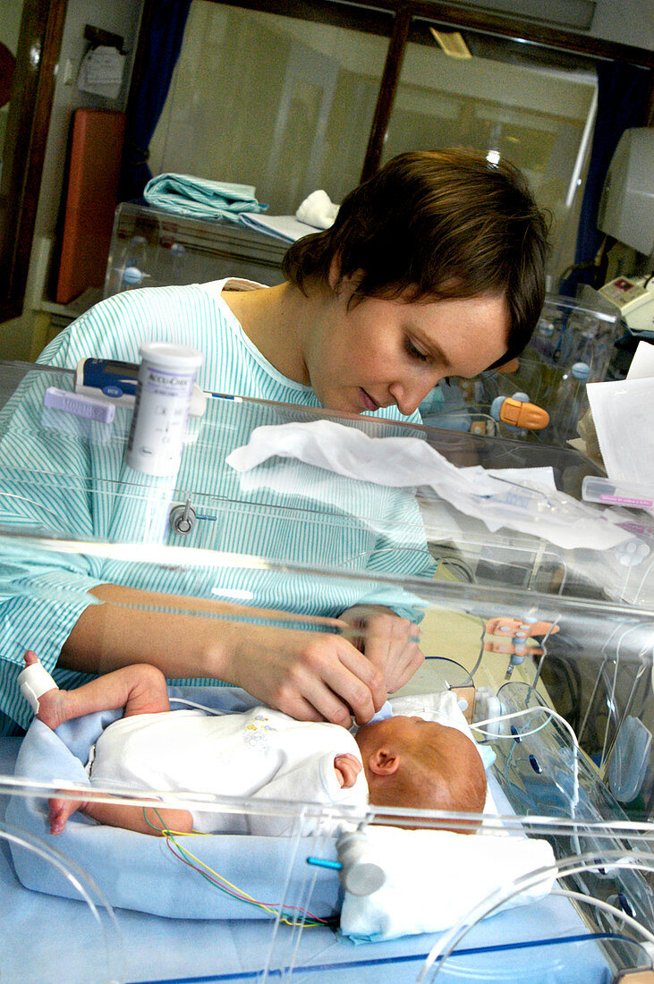 Nurse attending a premature baby