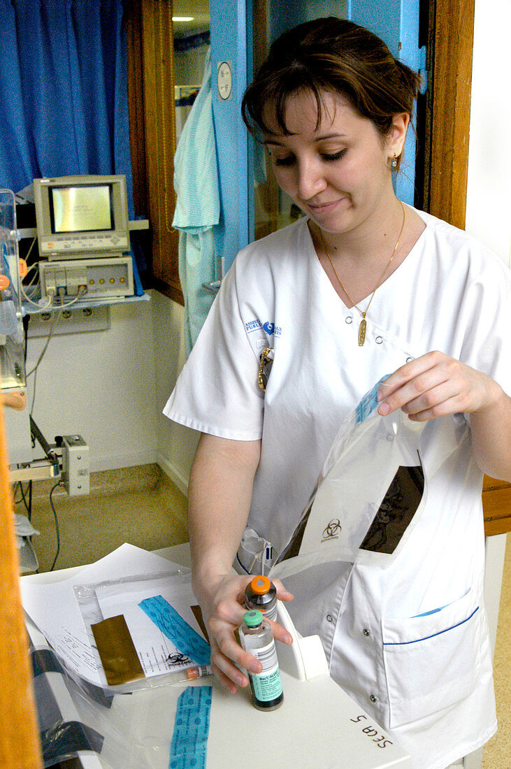 Nurse with sample bottles