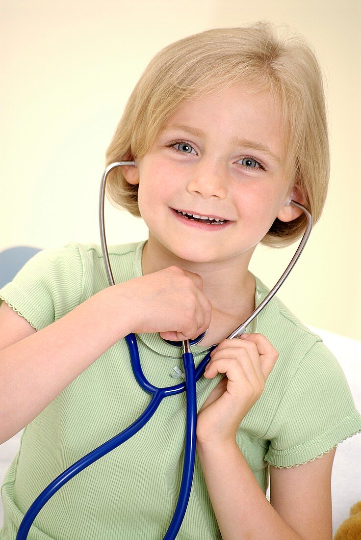 Girl using a stethoscope
