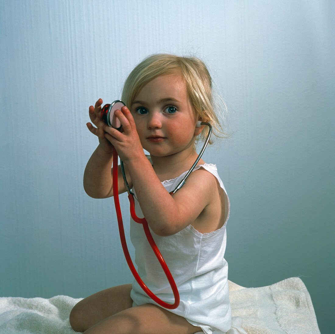 Girl playing with a stethoscope
