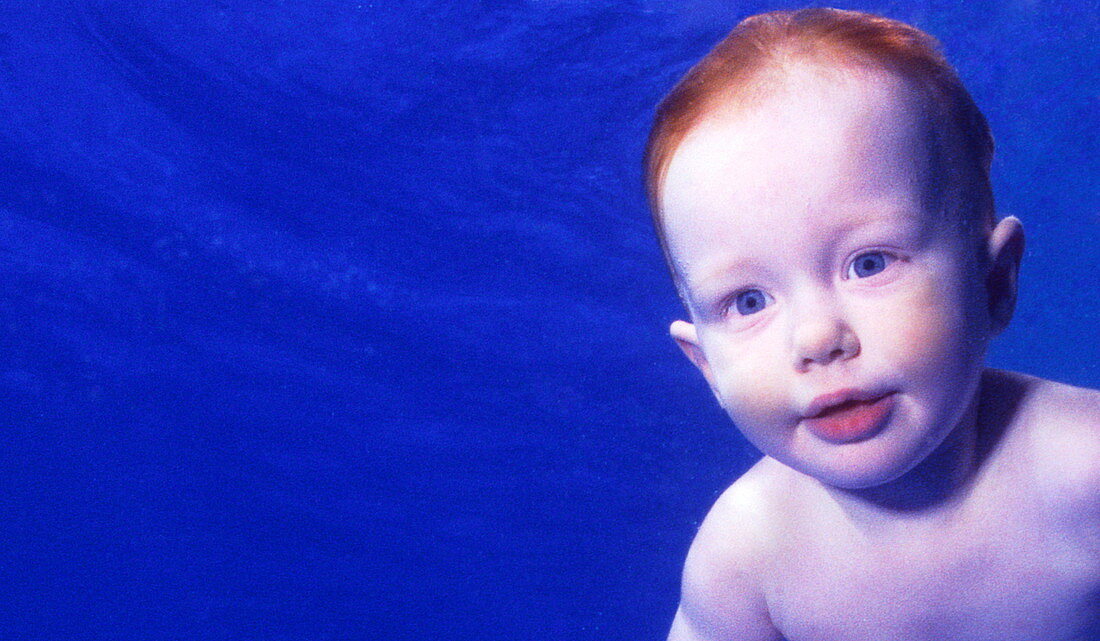 Baby swimming underwater