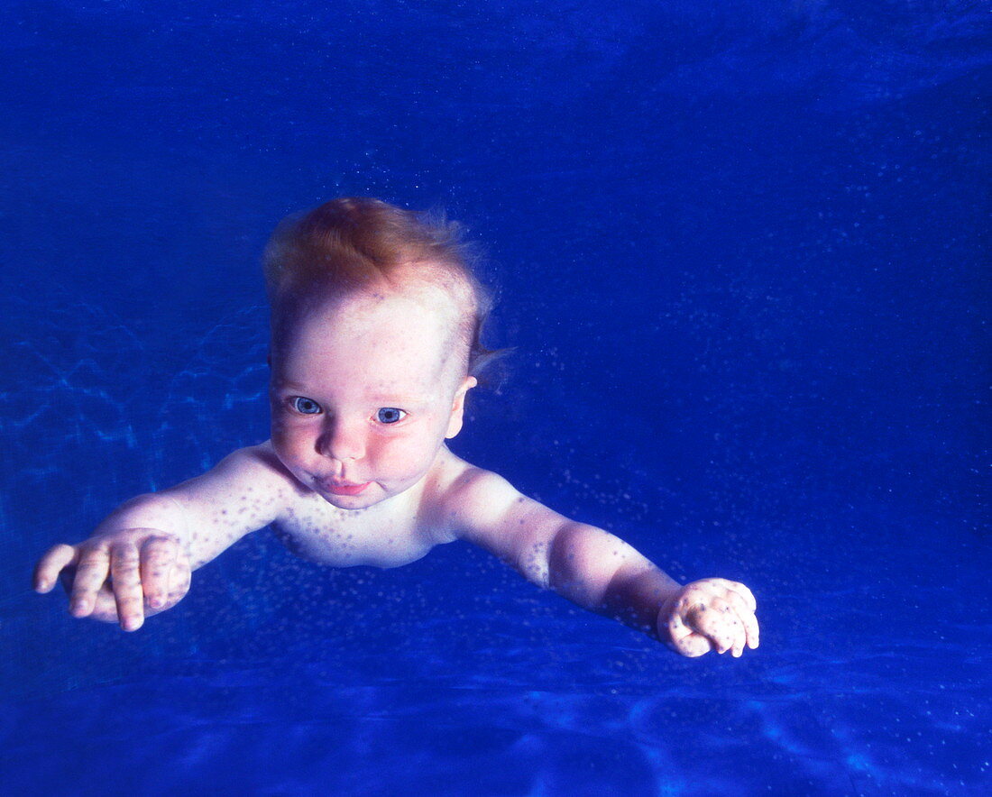 Baby swimming underwater