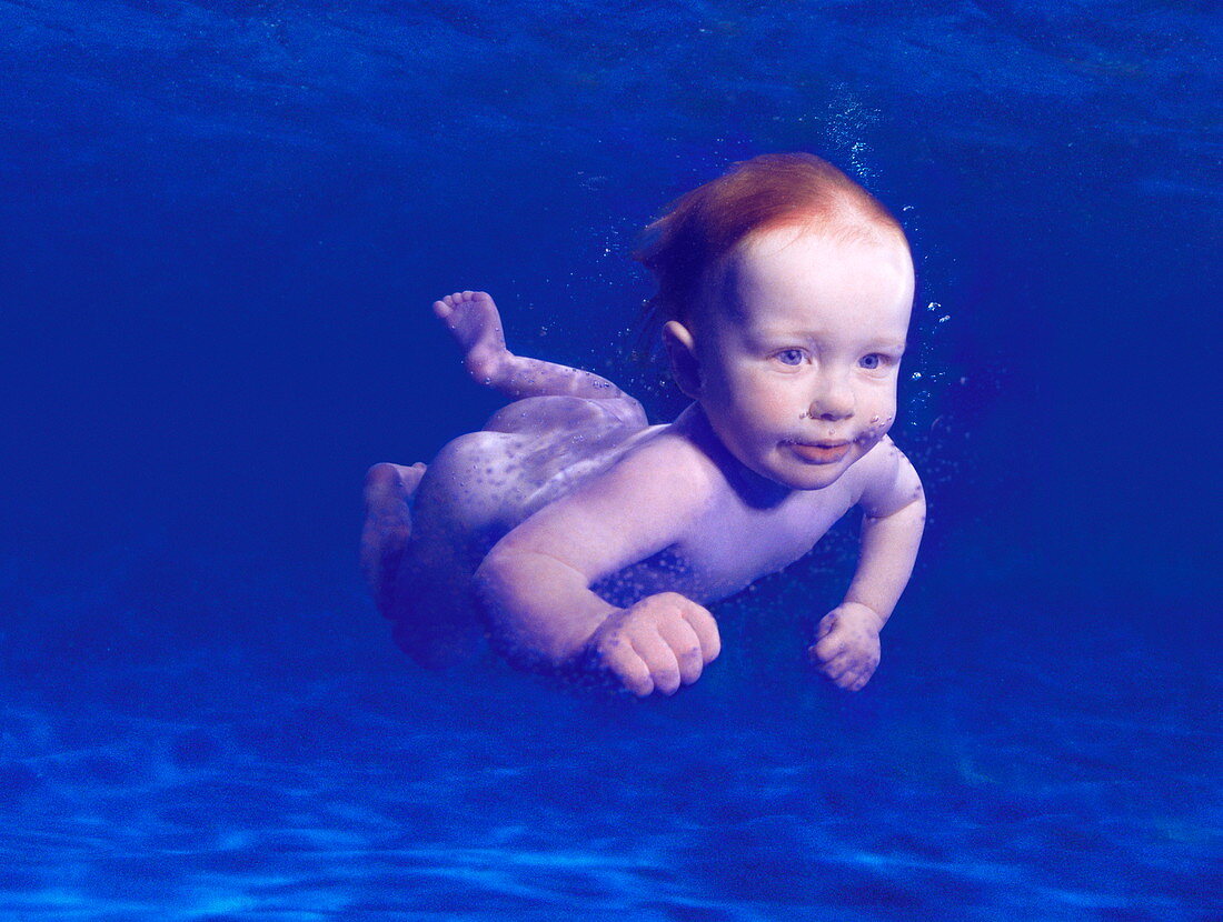 Baby swimming underwater