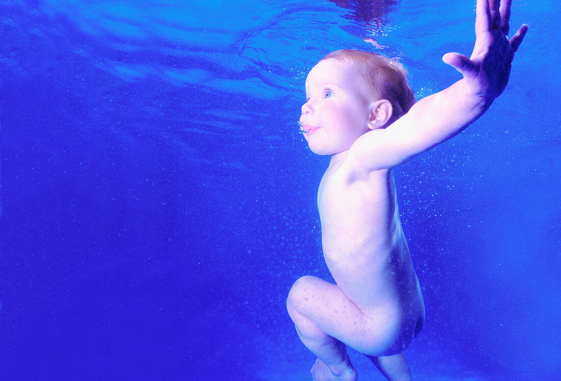 Baby swimming underwater