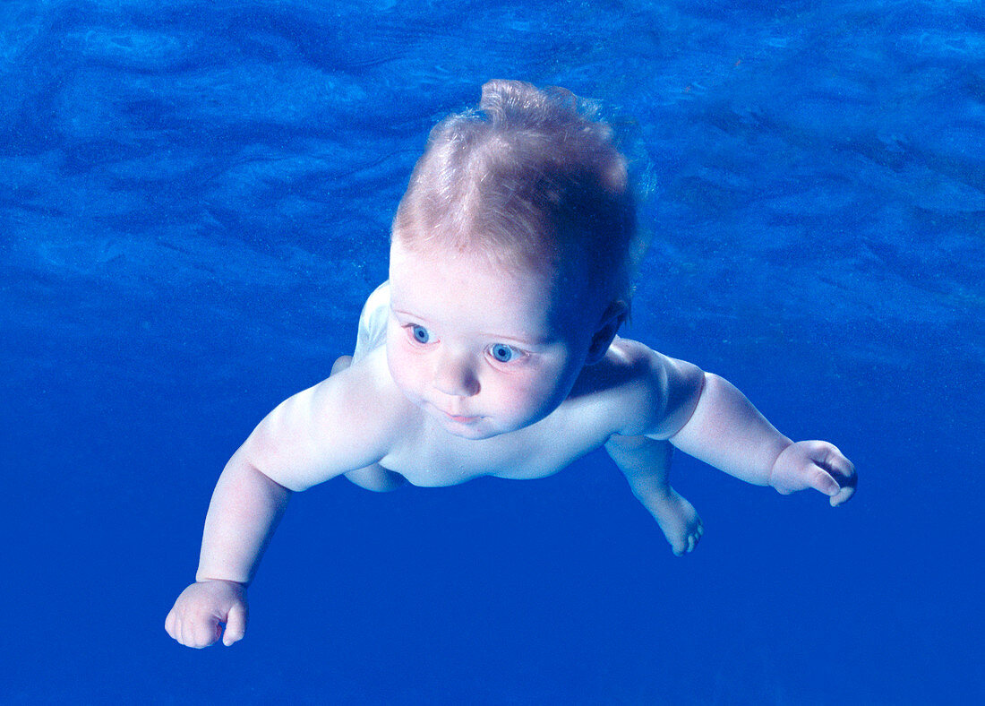 Baby swimming underwater