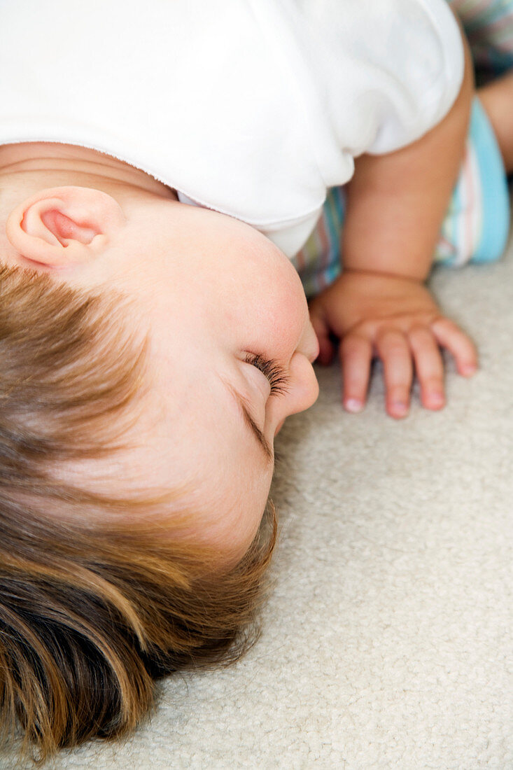 Toddler lying face down