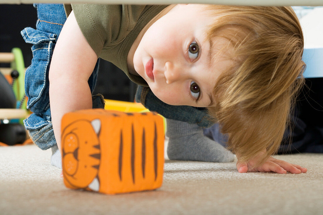 Toddler bending down