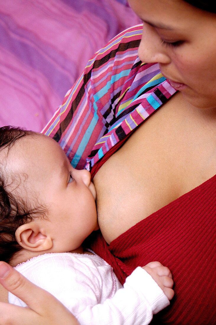 Baby girl breast feeding