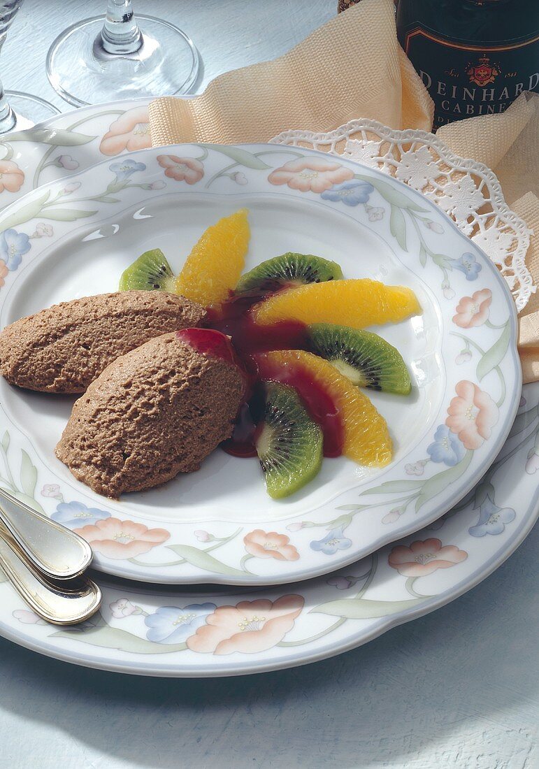 Mousse au chocolat with fruit salad and fruit sauce