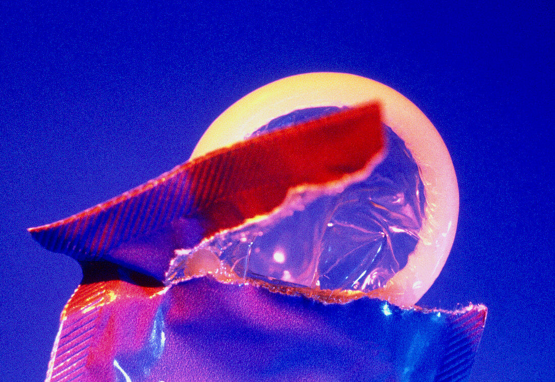 Condom partly projecting from an opened packet