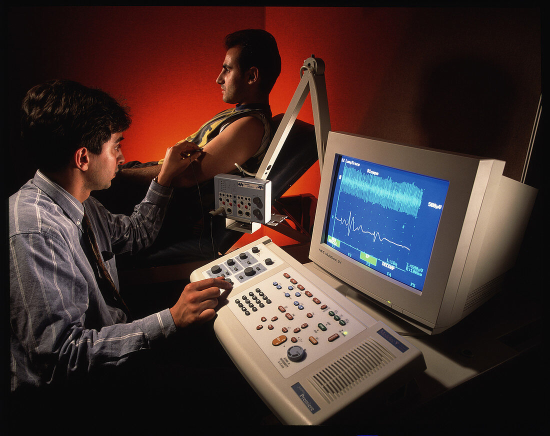 Man undergoing electromyogram (EMG) muscle test