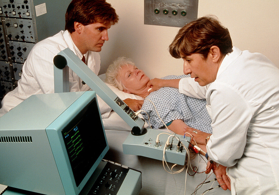 Woman undergoing electromyogram (EMG) muscle test