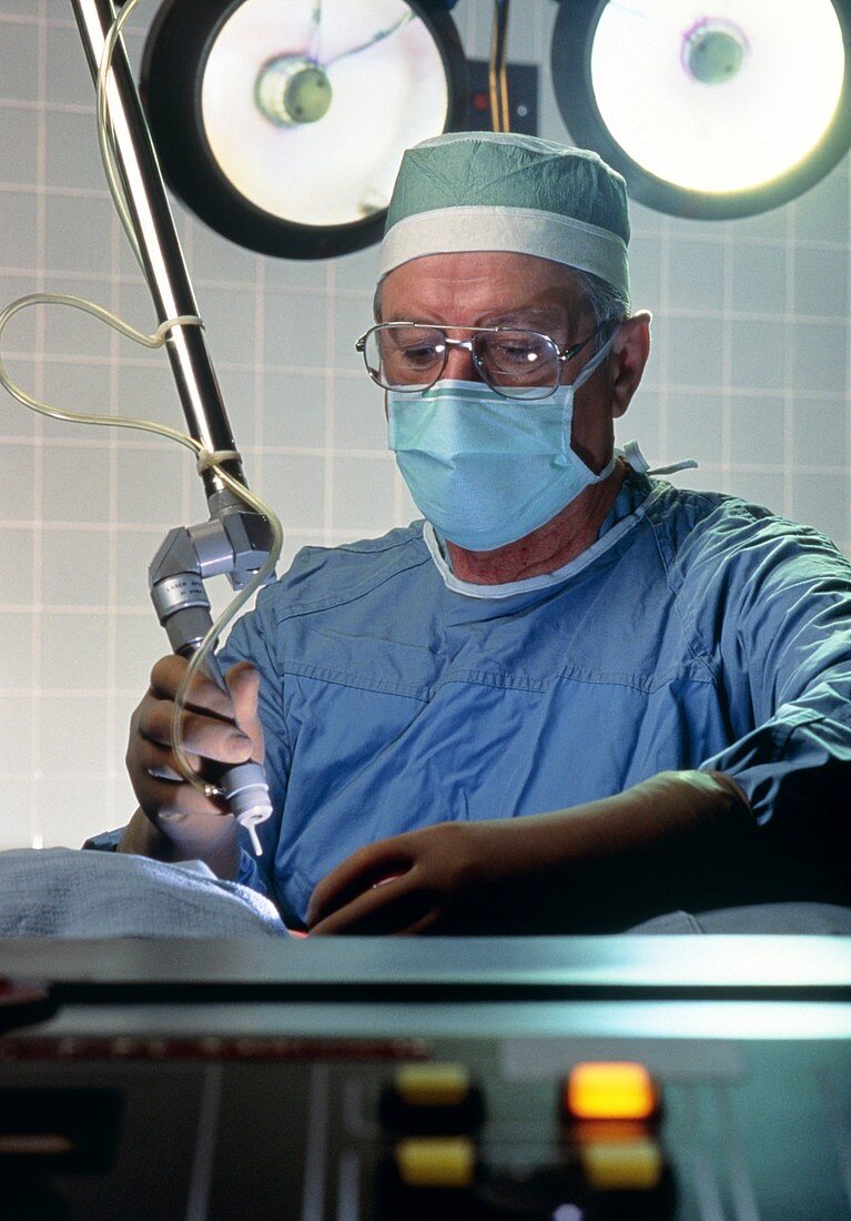 Portrait of surgeon using laser scalpel