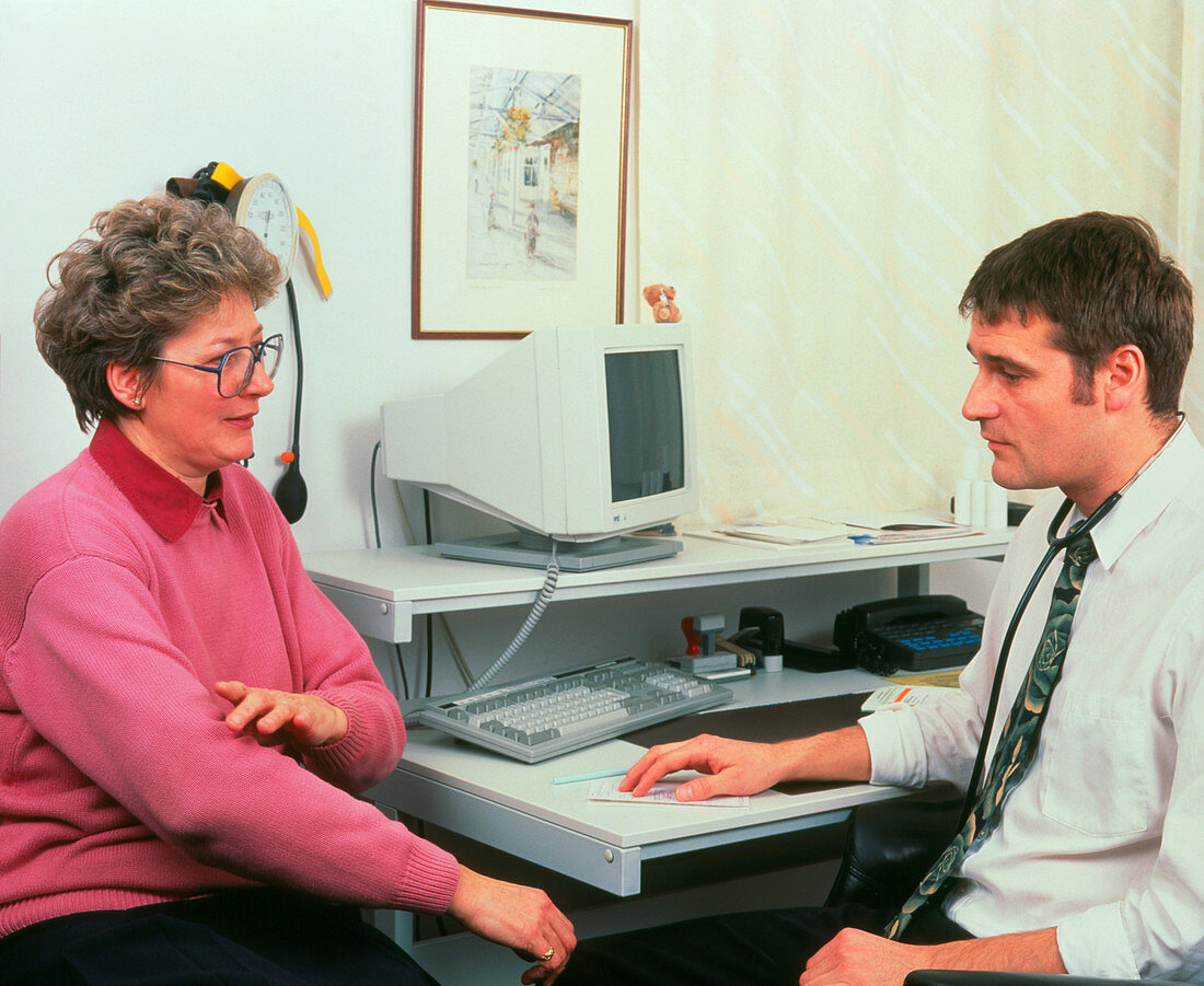GP doctor in consultation with a woman patient