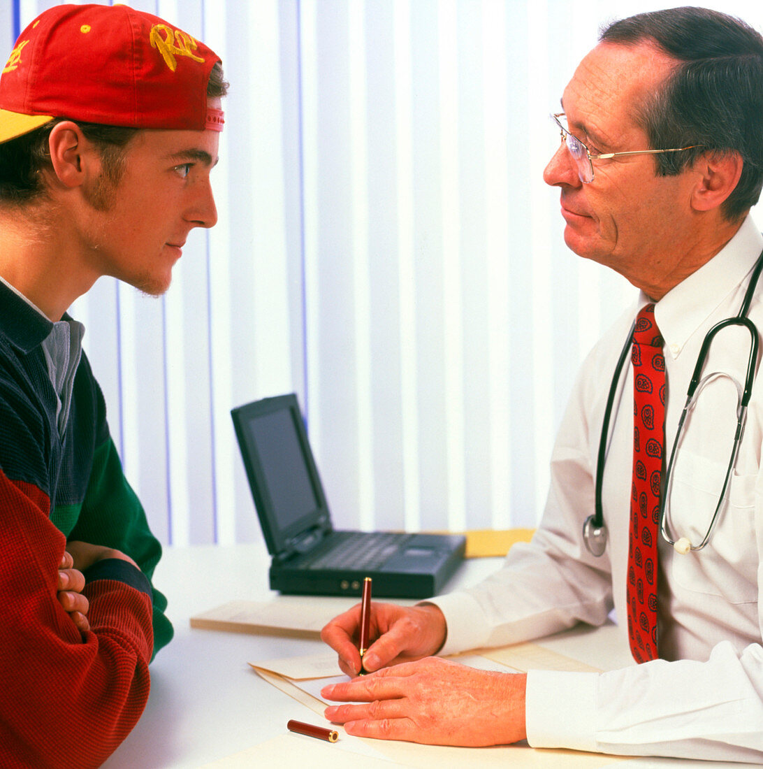 Teenage boy consults his GP doctor