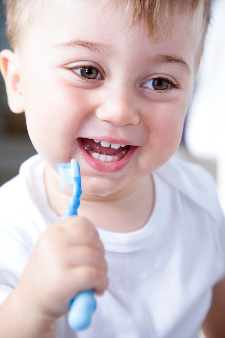 Young boy brushing his teeth