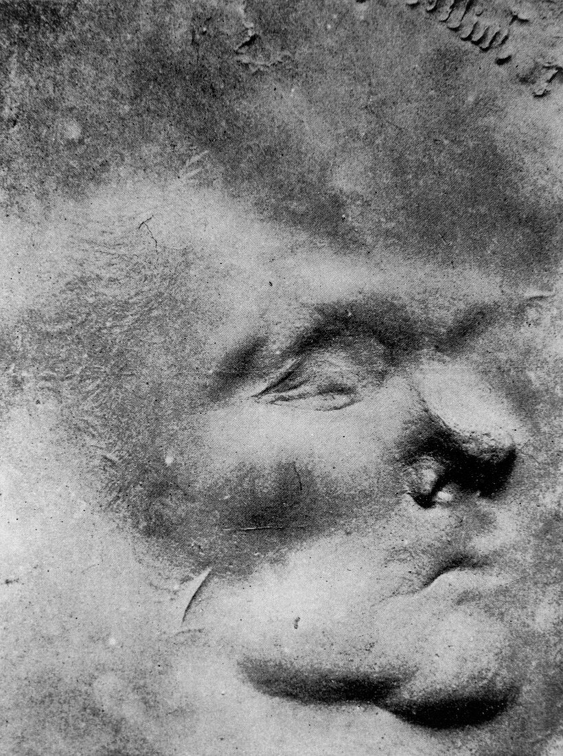 Image of a face formed in putty by psychic force