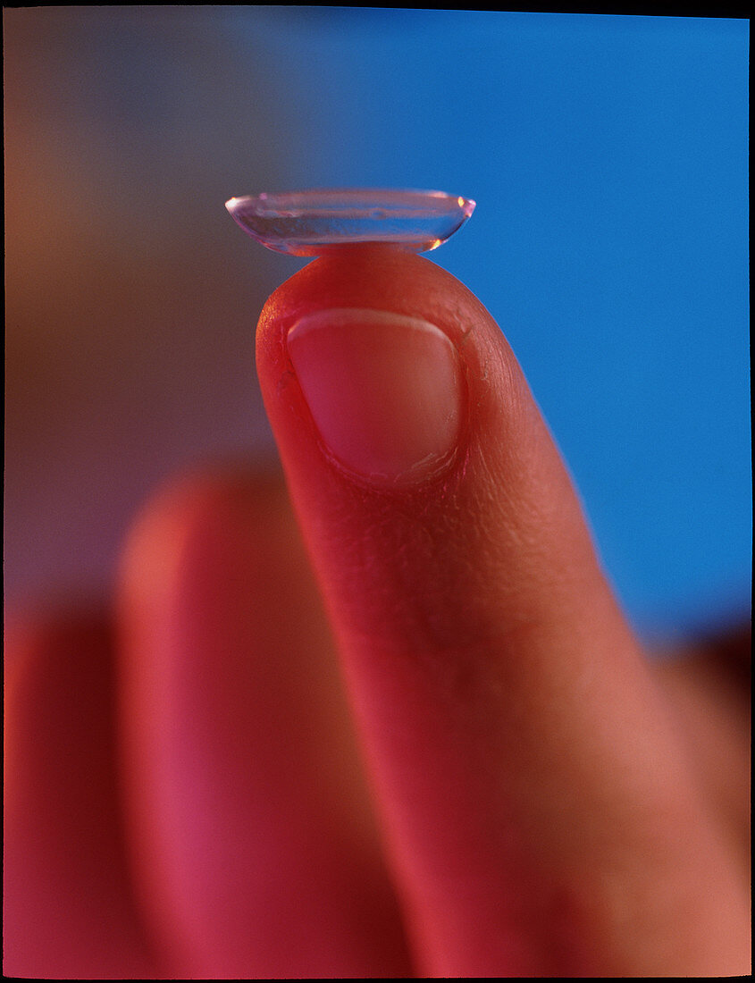 Contact lens seen on a fingertip