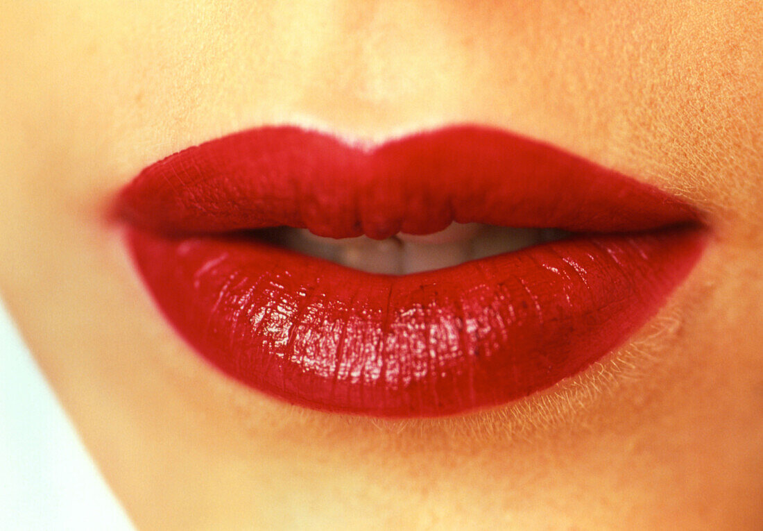 Close-up of the mouth of a woman wearing lipstick