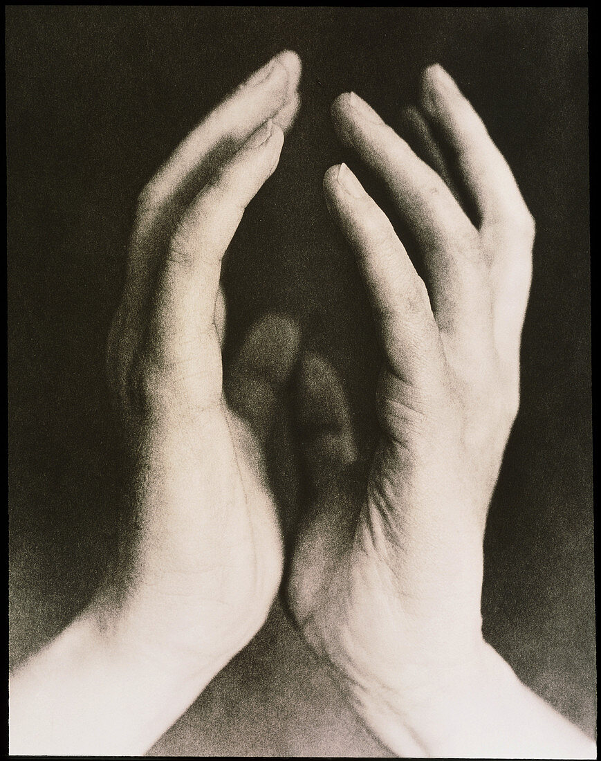 View of a woman's hands held together