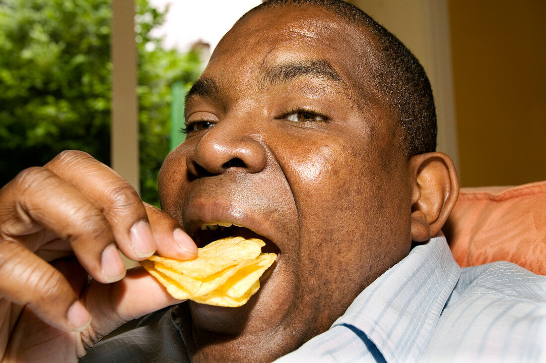 Man eating crisps